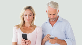 Toronto couple using smartphones